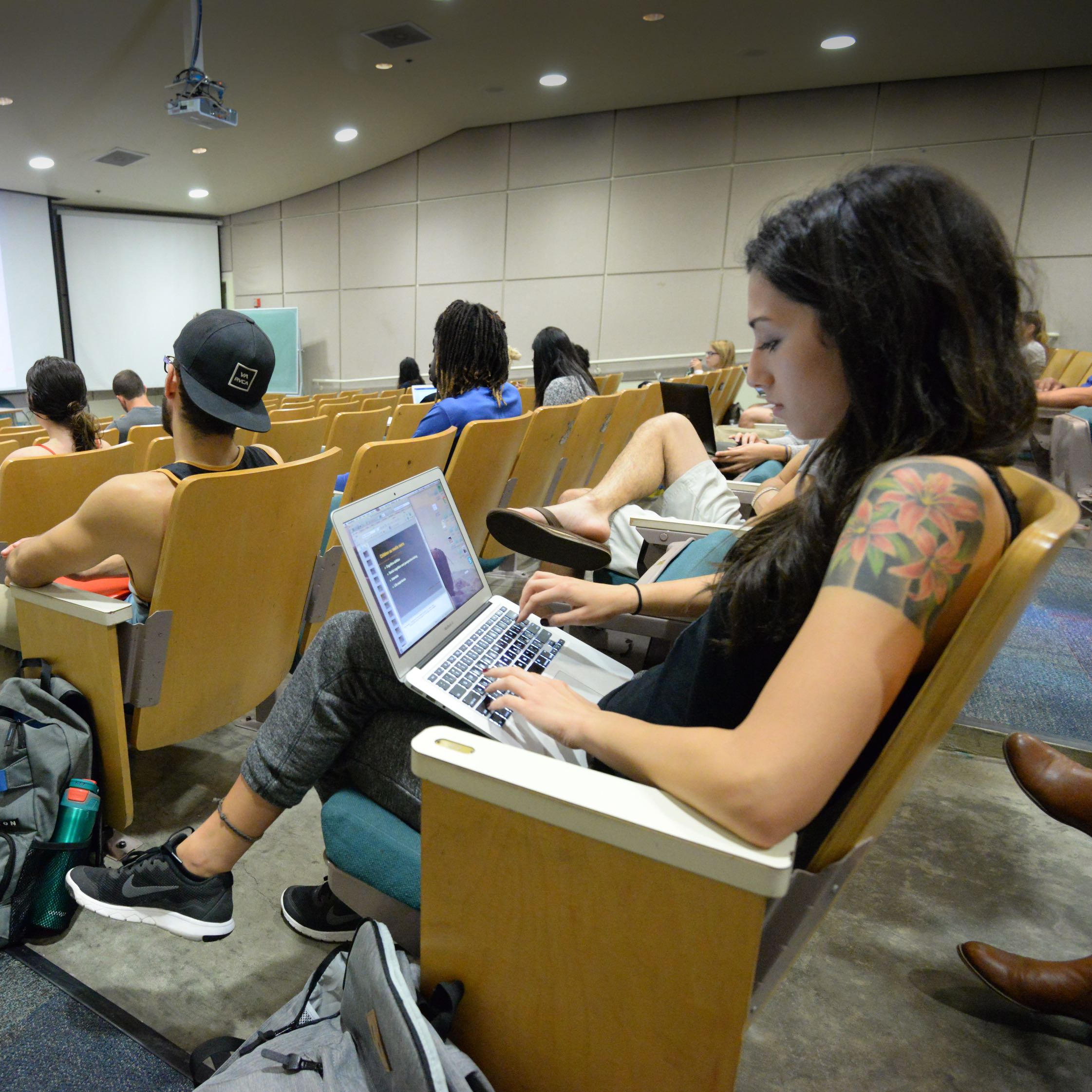 Student studying in lecture hall